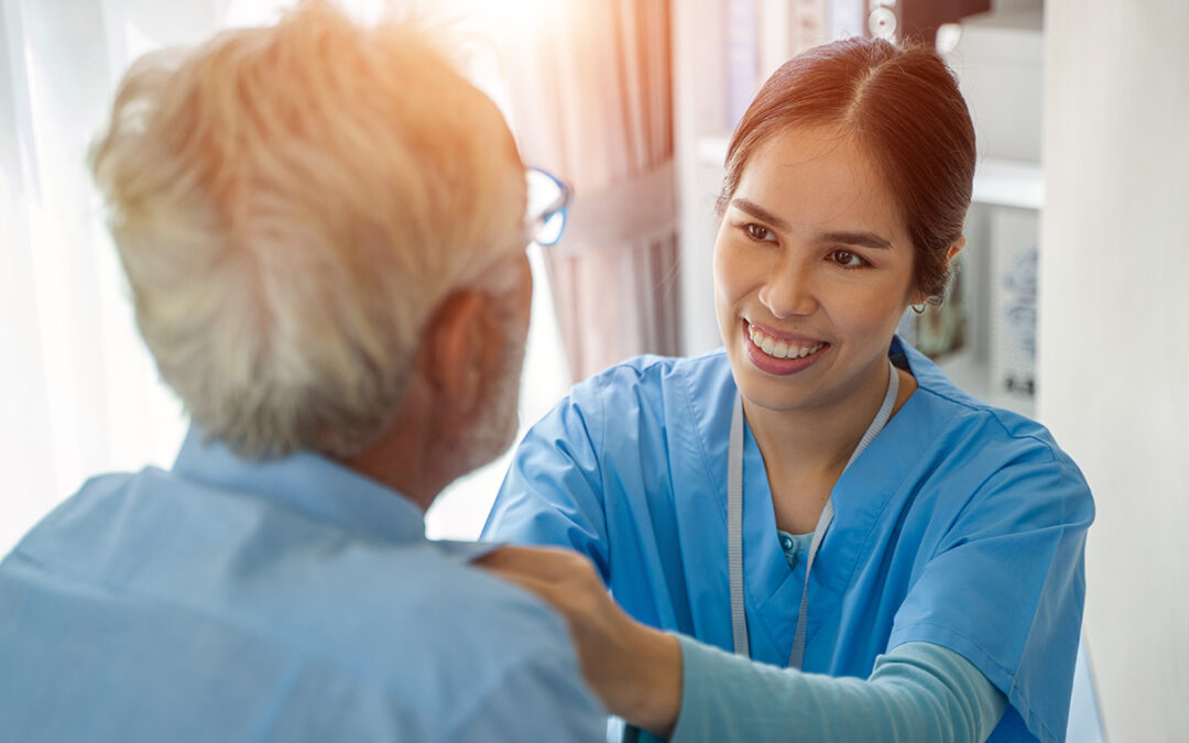 Nurse caring for elderly man