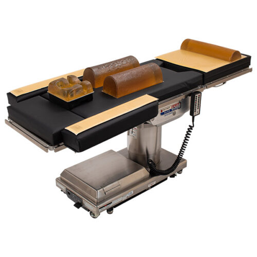 Adult-sized chest rolls placed on an operating table.