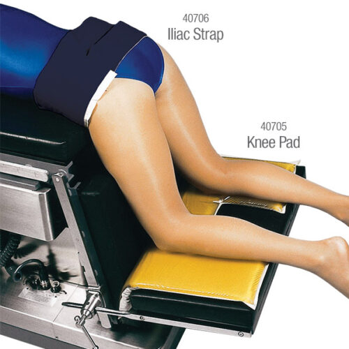 The Andrews Iliac Strap wrapped around the waist of a patient who is also using knee pads