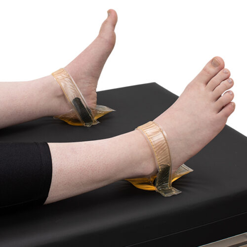 Patient wearing a heel comfort cup set in the prone position.