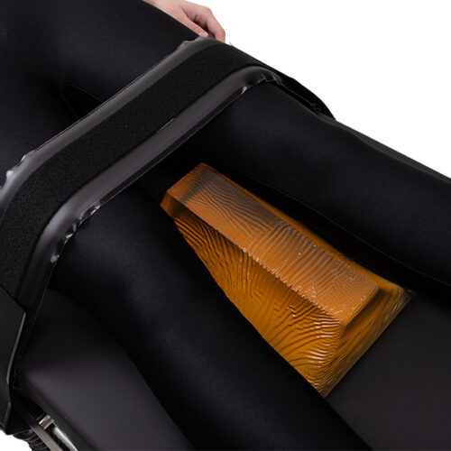Trapezoid positioner that has been placed between a patient's legs.