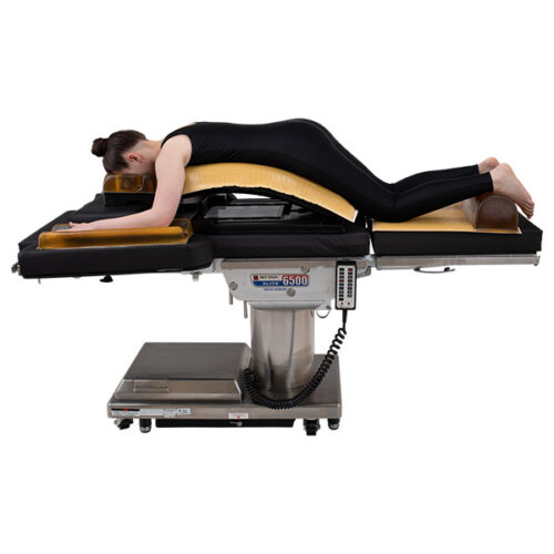 Patient lying on her stomach using a Wilson Frame